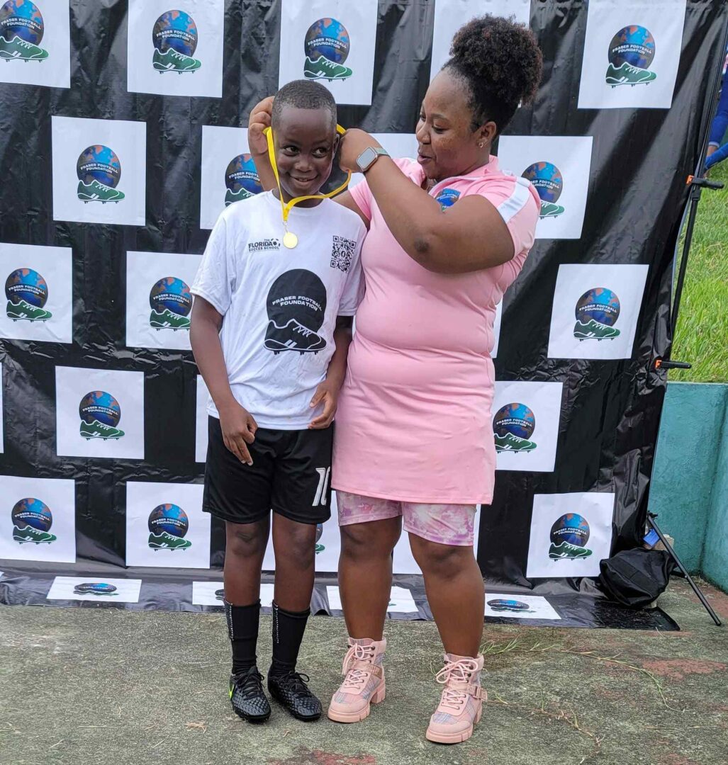 A woman and child standing next to each other.