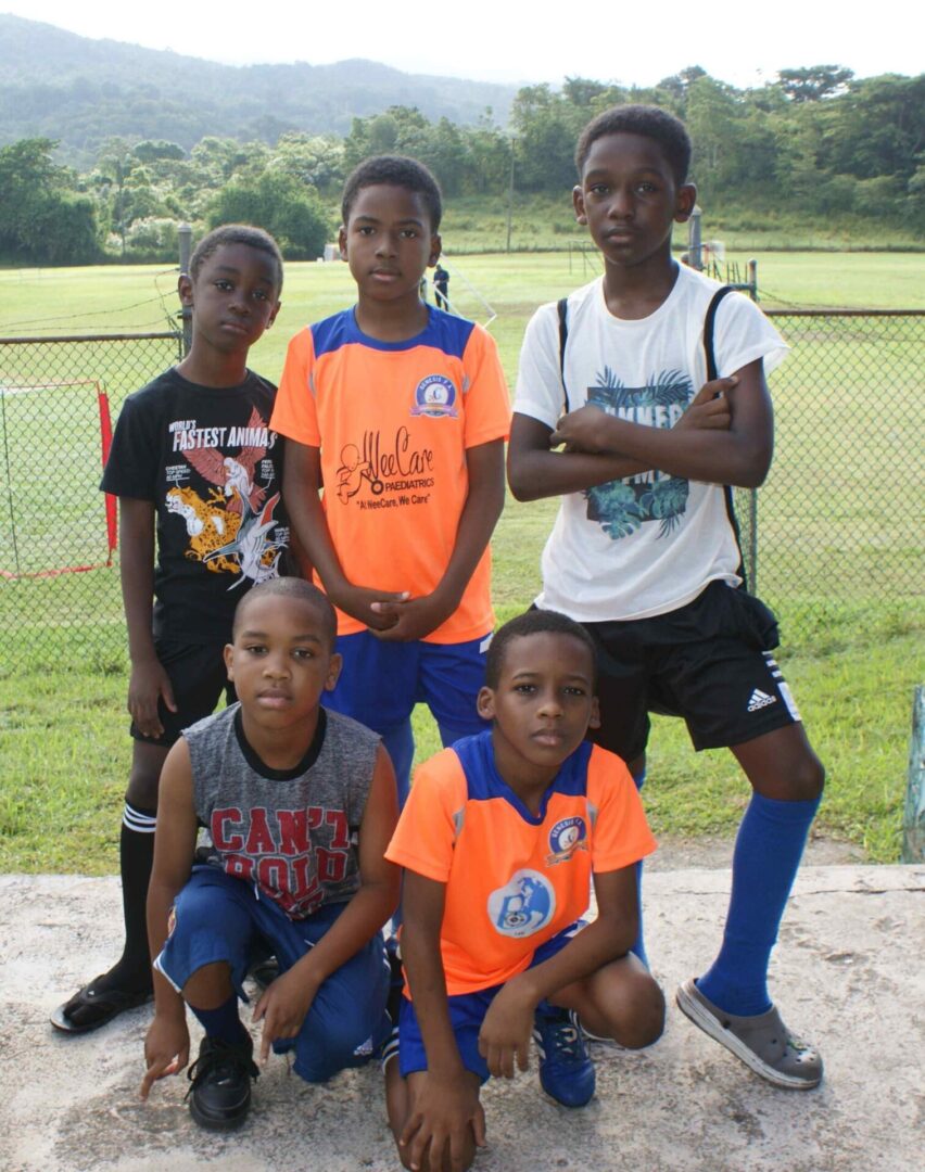 A group of young boys posing for a picture.