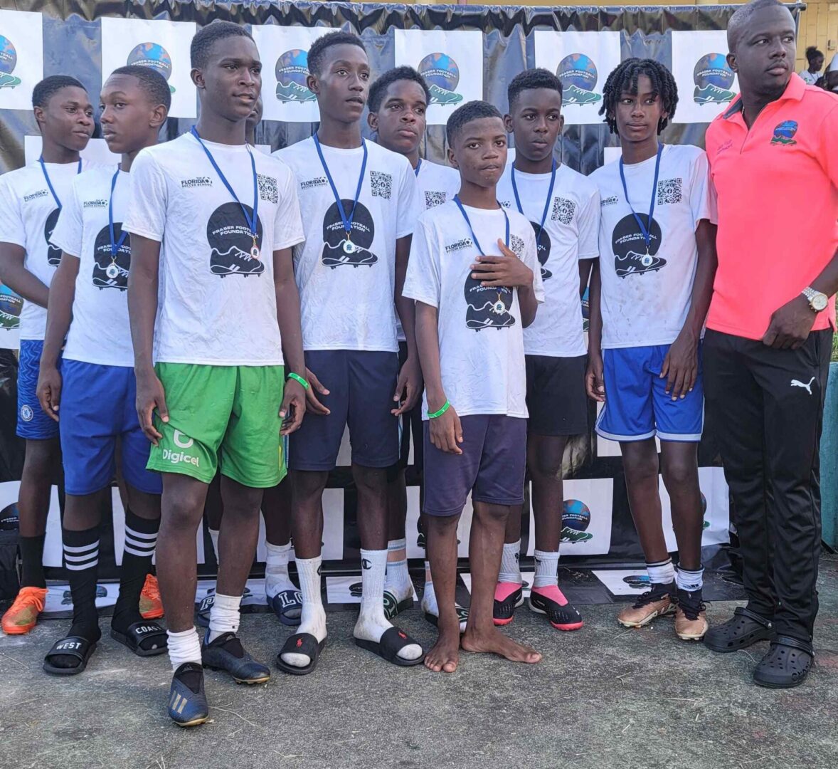 A group of young men standing next to each other.