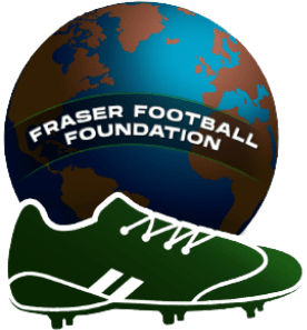 A green football shoe and a ball